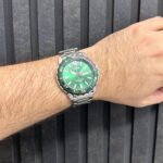 ساعت کاسیو MTD-125D-3AVDF با صفحه سبز و قاب سبز در نمای باز