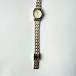 تصویر ساعت مچی زنانه Q&Q C50A-002 با صفحه طلایی و بند استیل طلایی